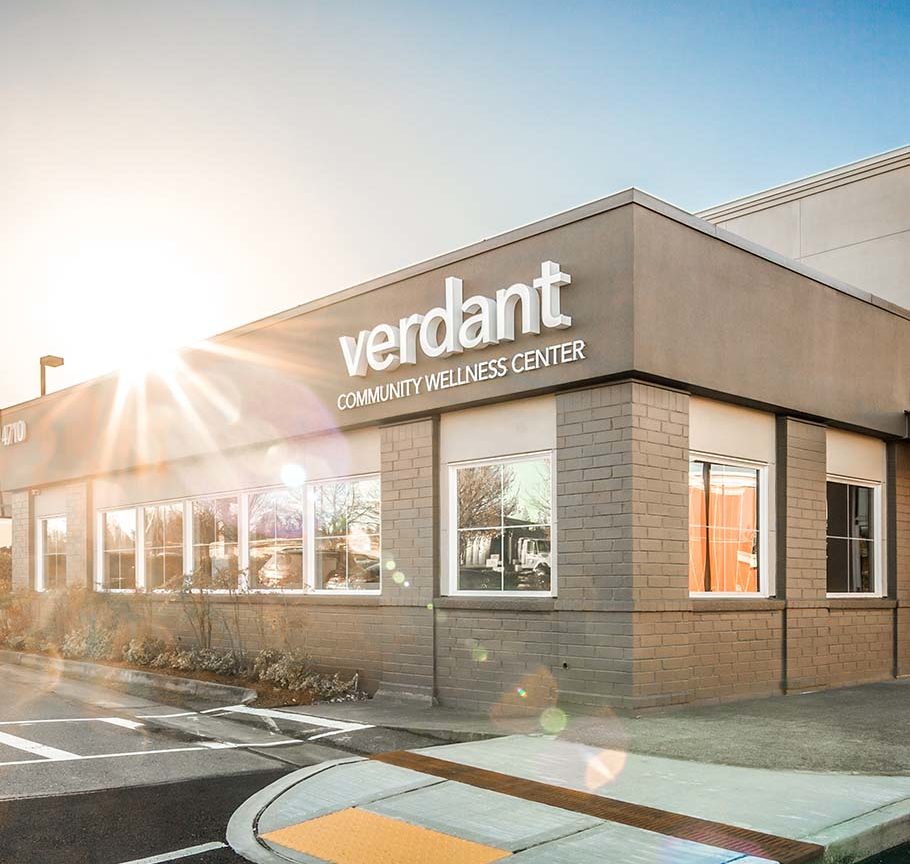 Sun rising behind Verdant community center building