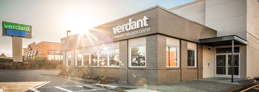 Sun rising behind Verdant community center building